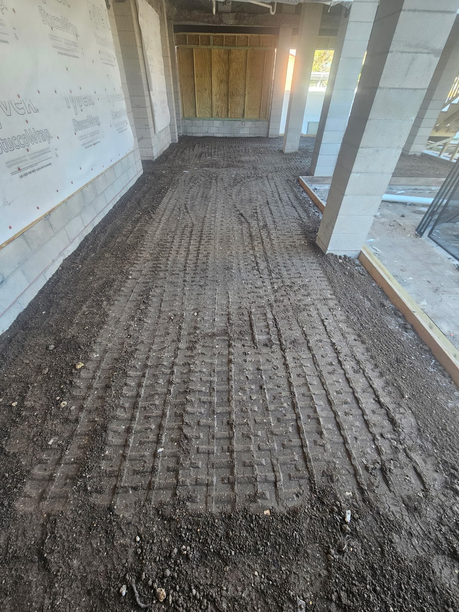 Backfill and compaction inside a Tampa Bay building pad