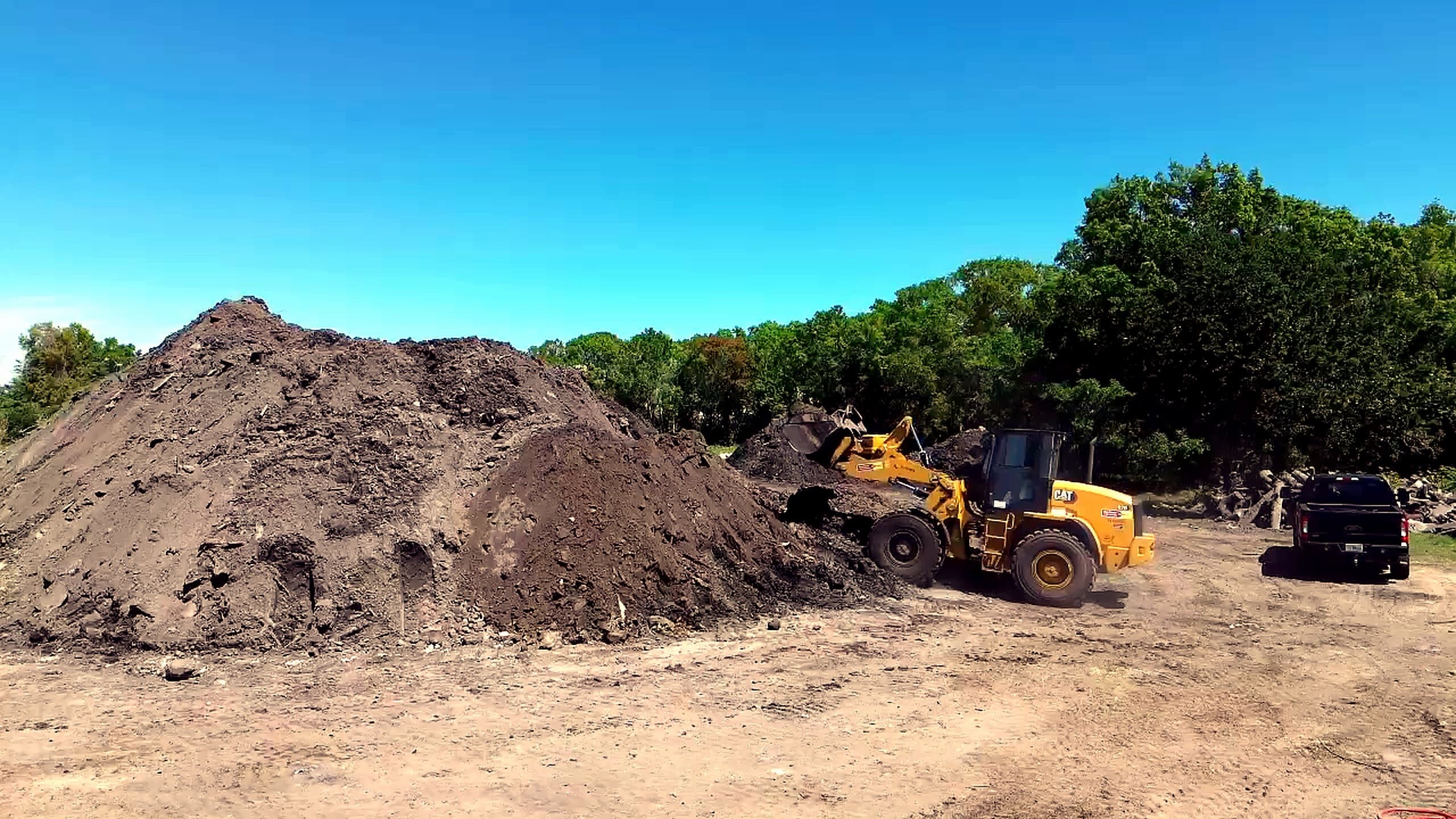 Commercial site preparation with heavy equipment in Tampa Bay