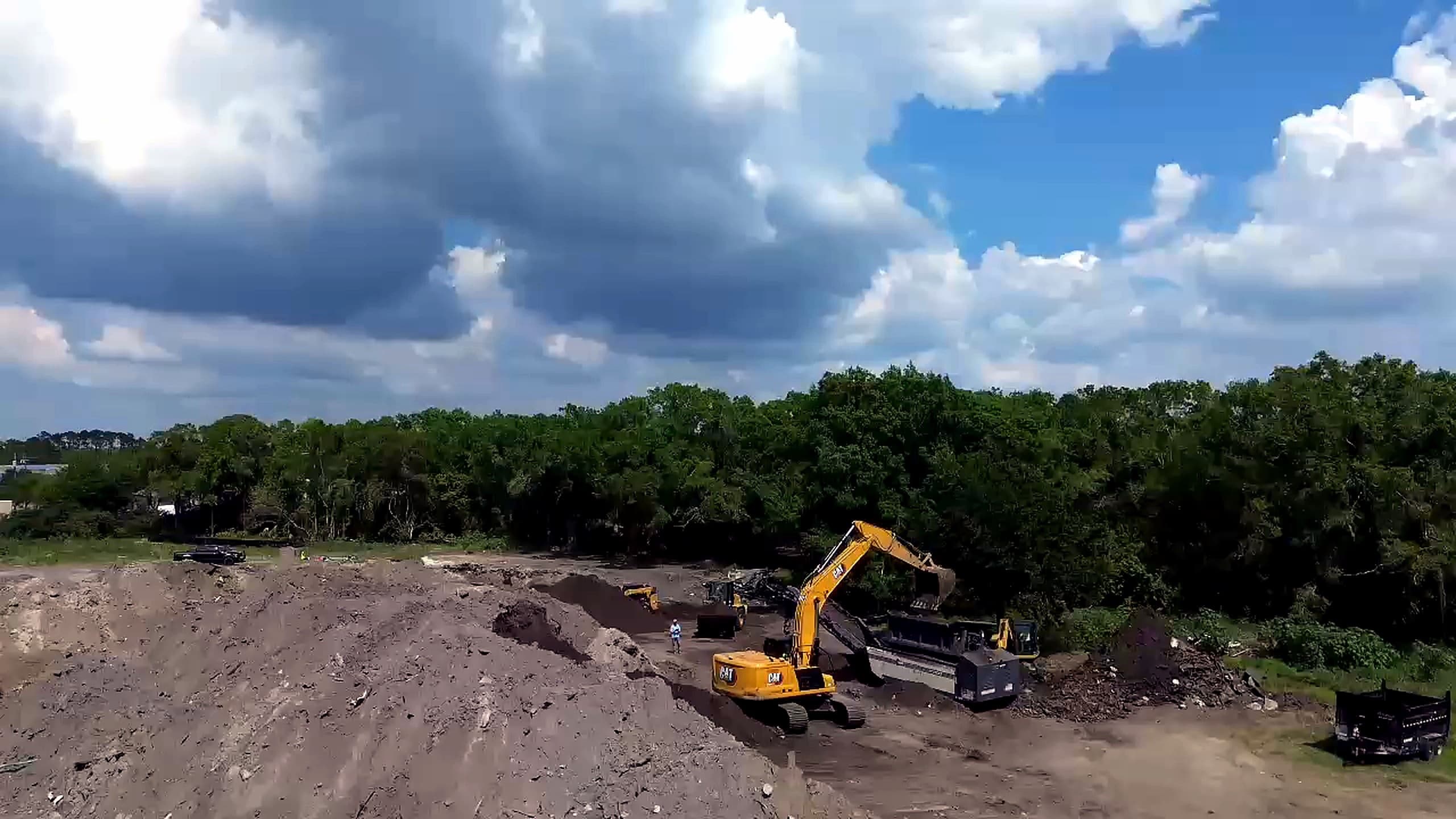 Imported fill dirt delivered for a Tampa Bay sitework project