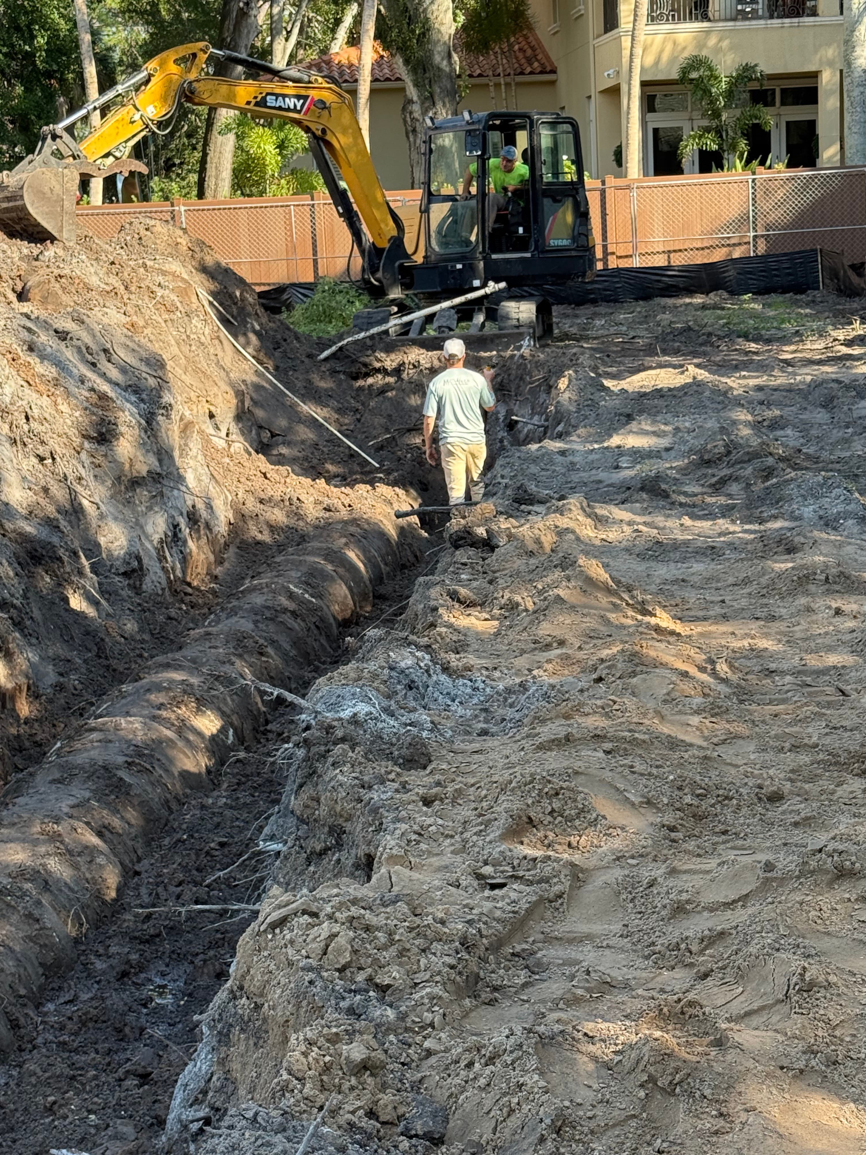 Detailed grading and excavation work near a residence
